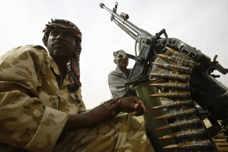 Fighters from the Sudanese Rapid Support Forces sit on an armed vehicle in the city of Nyala, in south Darfur, on May 3, 2015 [ASHRAF SHAZLY/AFP via Getty Images]